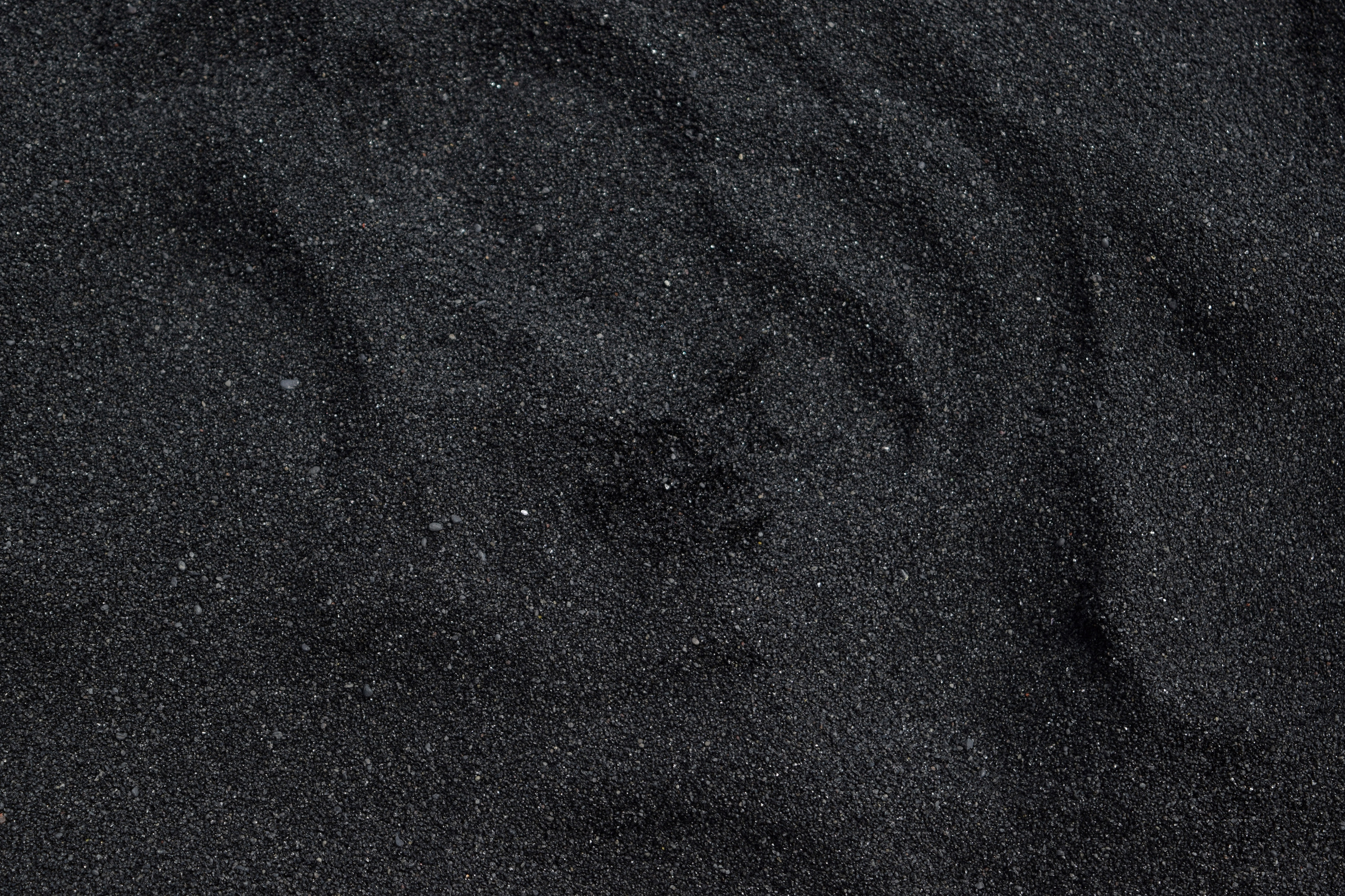 Close Up Photo of Black Sand